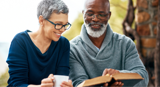Seniors going to meet with an insurance agent to discuss Medicare enrollment options, including Part A, B, C, and D coverage.
