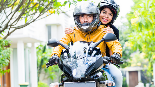 Motorcyclist rides near scenic coast; get tailored motorcycle insurance for peace of mind on every journey.